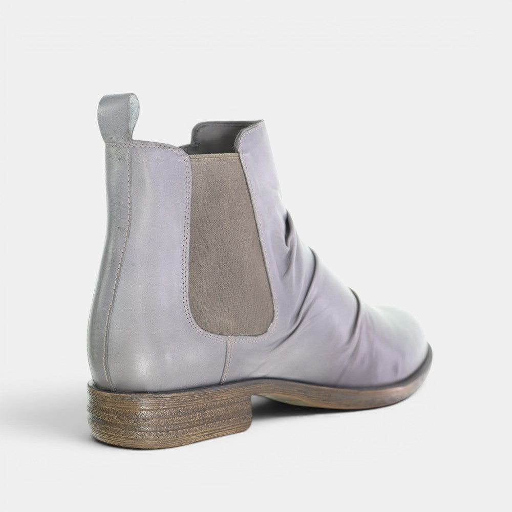 Le Sansa Lucy Stone boots with ankle-high design, featuring textured stone-colored leather and lace-up front.