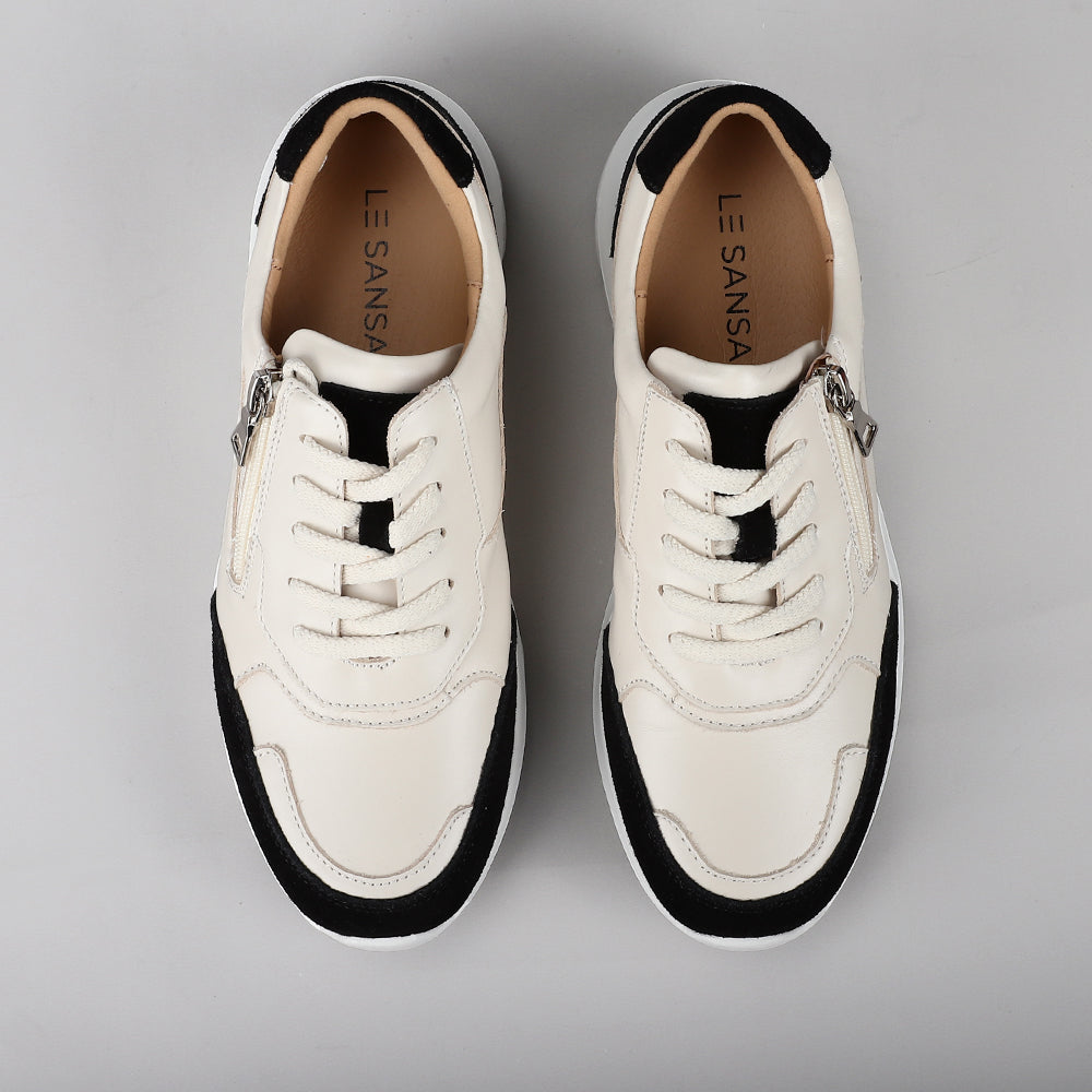 Le Sansa Ryder black sneakers featuring a sleek design with a comfortable fit and stylish black leather upper.