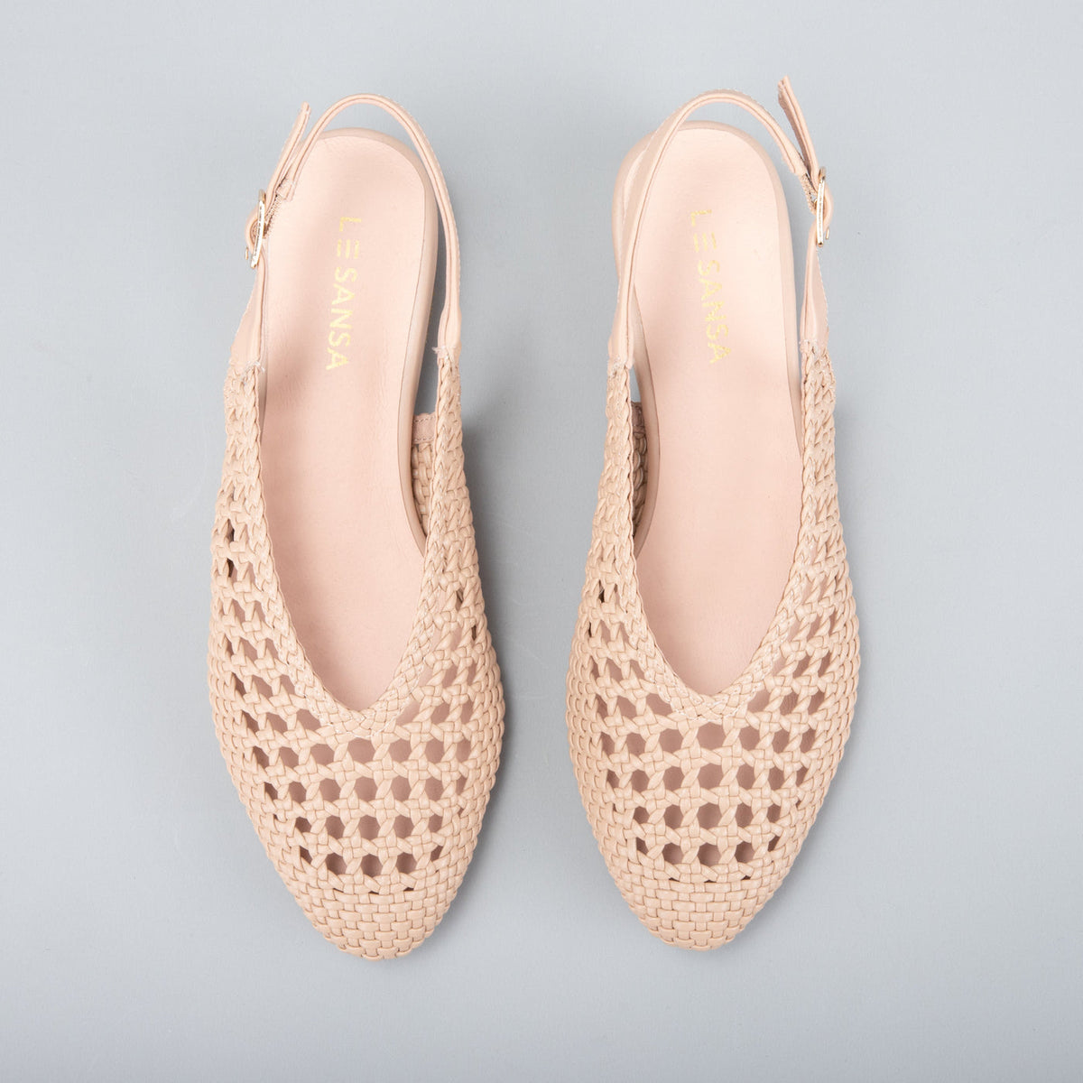 Le Sansa Camila Sandals with beige straps and flat sole, stylish and comfortable footwear for casual wear.