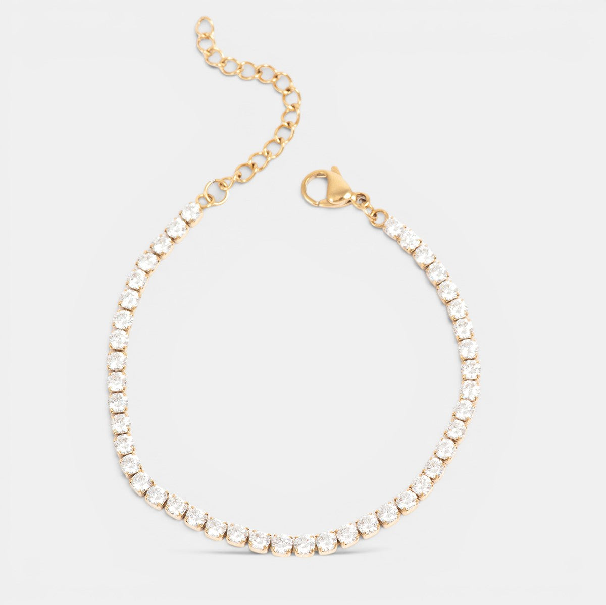 Gold plated steel CZ bracelet by A & C Oslo featuring sparkling cubic zirconia stones on a sleek, stylish jewelry piece.