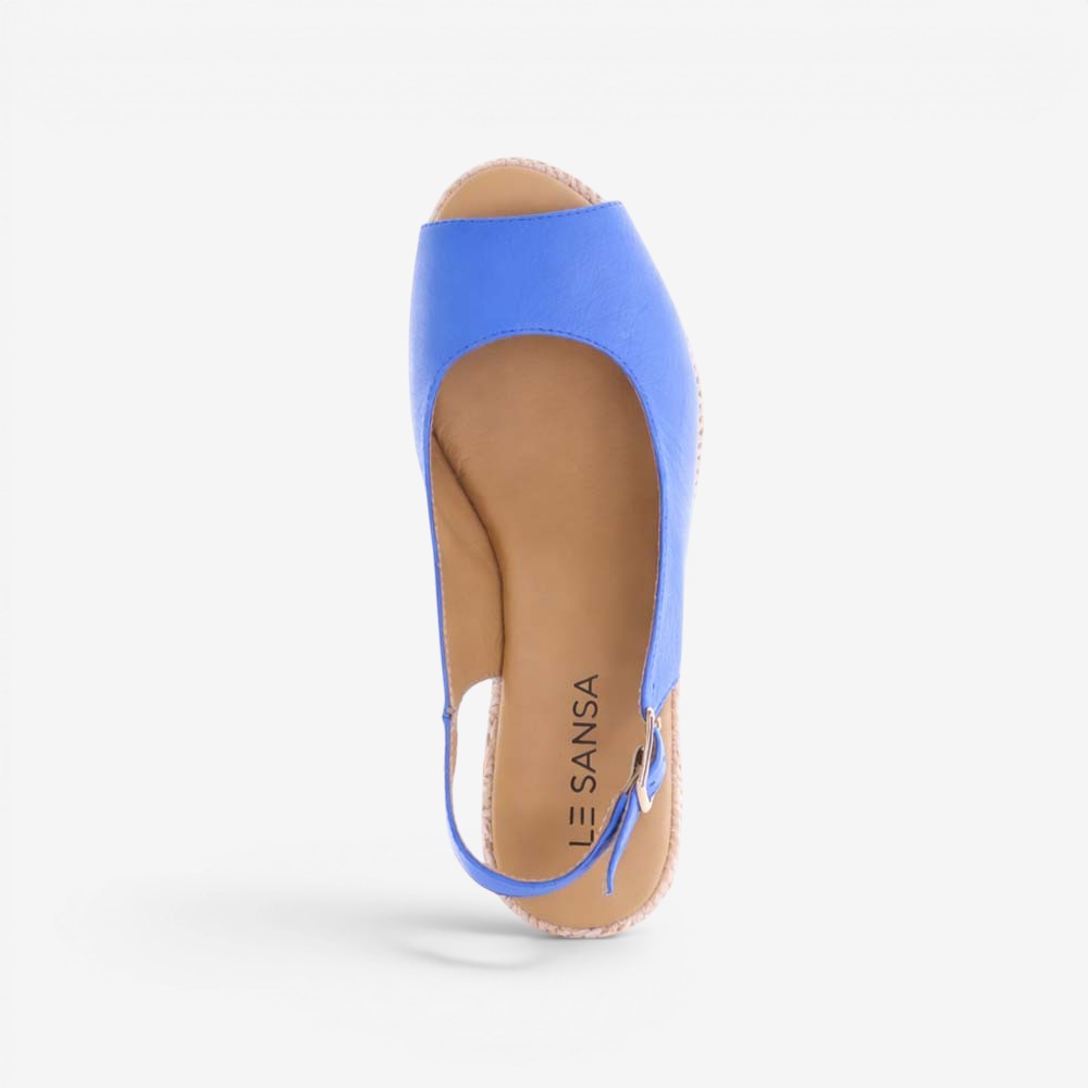Le Sansa Petunia Royal Blue sandals featuring open-toe design and ankle strap, stylish footwear for casual wear.