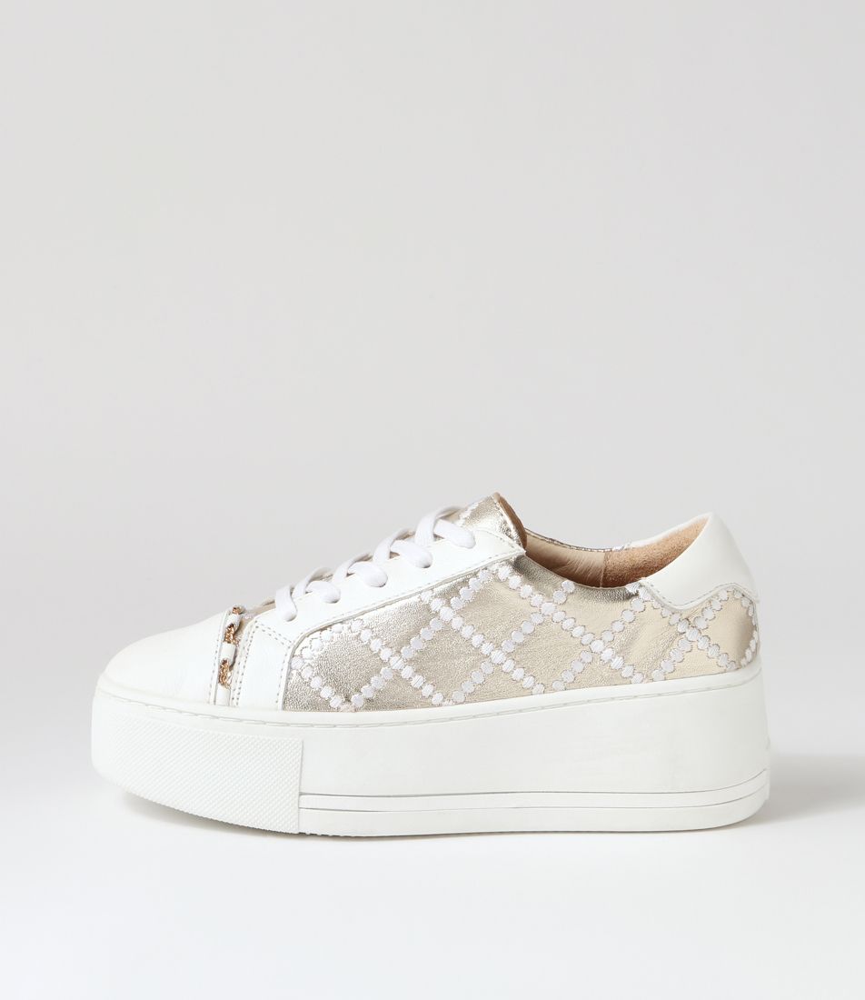 White gold sneakers by ALFIE & EVIE, showcasing stylish design and comfortable fit in a close-up image.