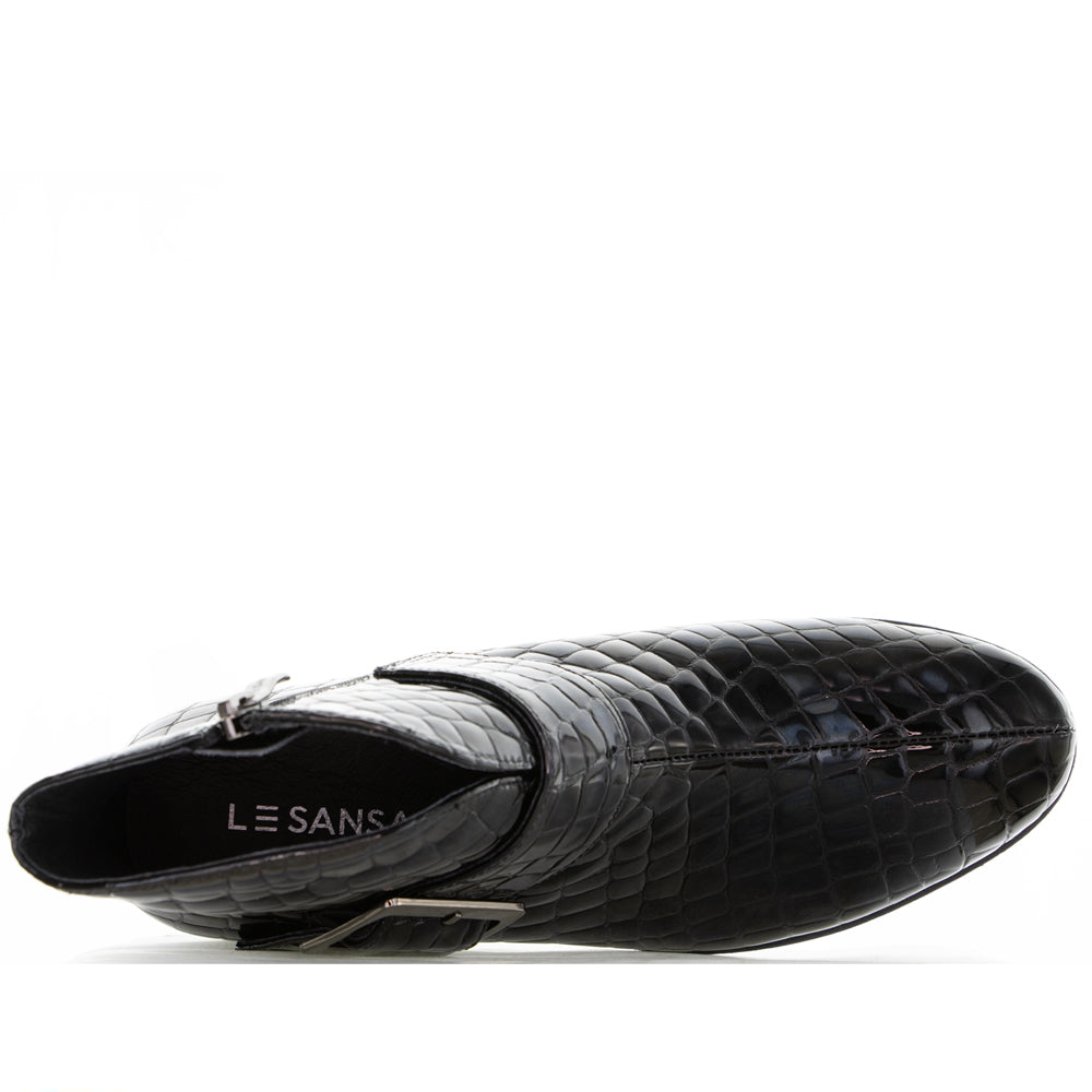 Black Le Sansa Andy boots with bold print design, featuring a sleek ankle-high silhouette and stylish laces.