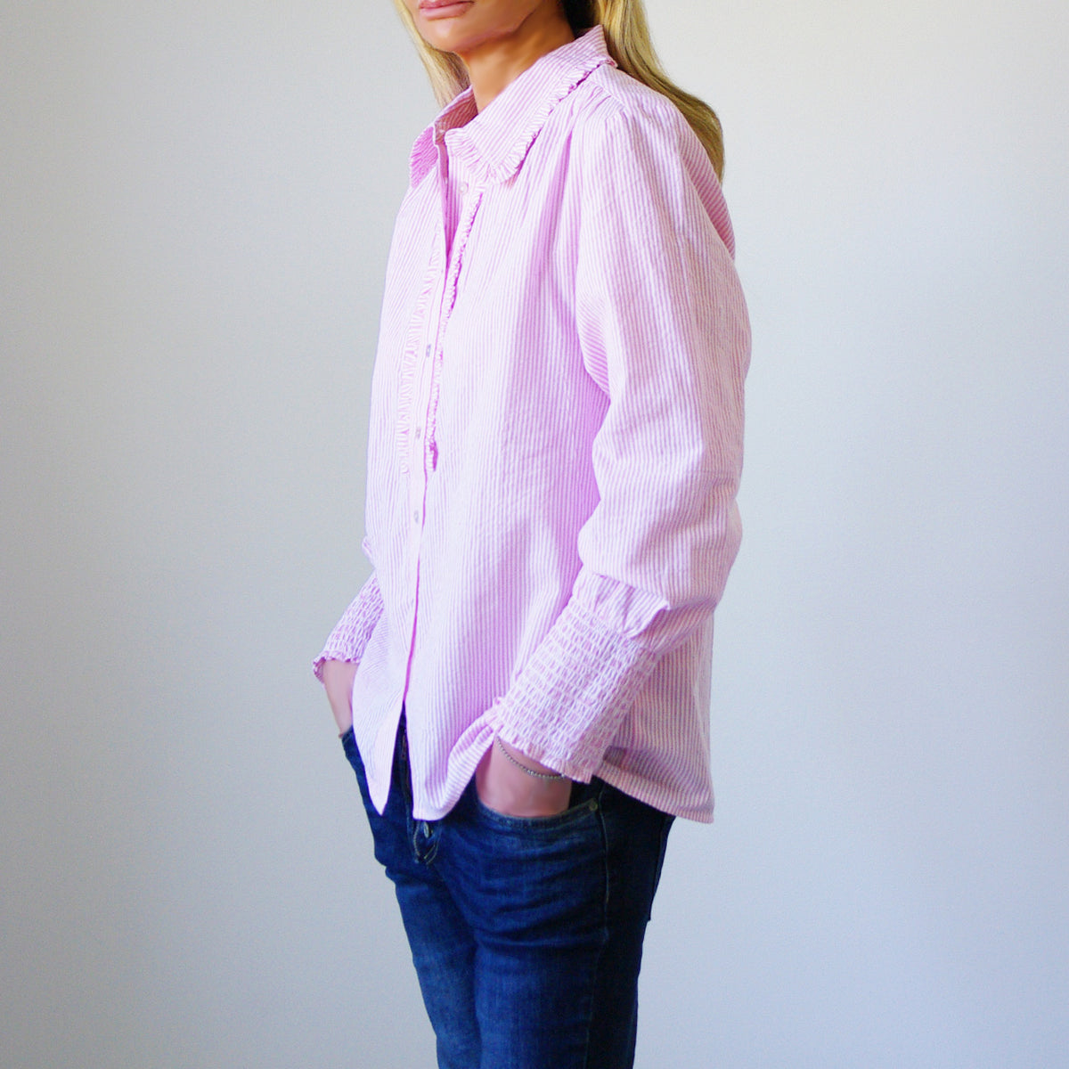 Pink and white striped cotton blouse by Who's Charlie, featuring a stylish, relaxed fit and side view.