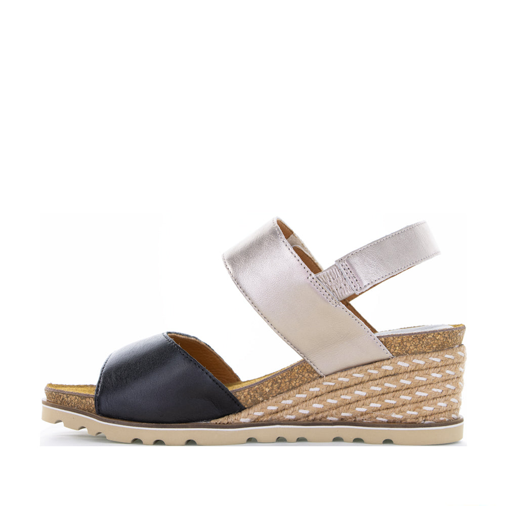 Black leather sandals from Le Sansa Evita collection with open toe design and ankle strap.