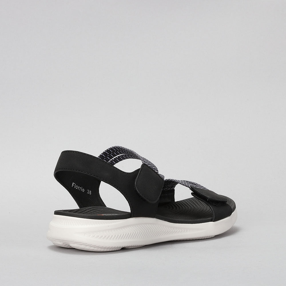 Black and multi-colored CC RESORTS Florie sandals with side straps, stylish and comfortable footwear for warm weather.