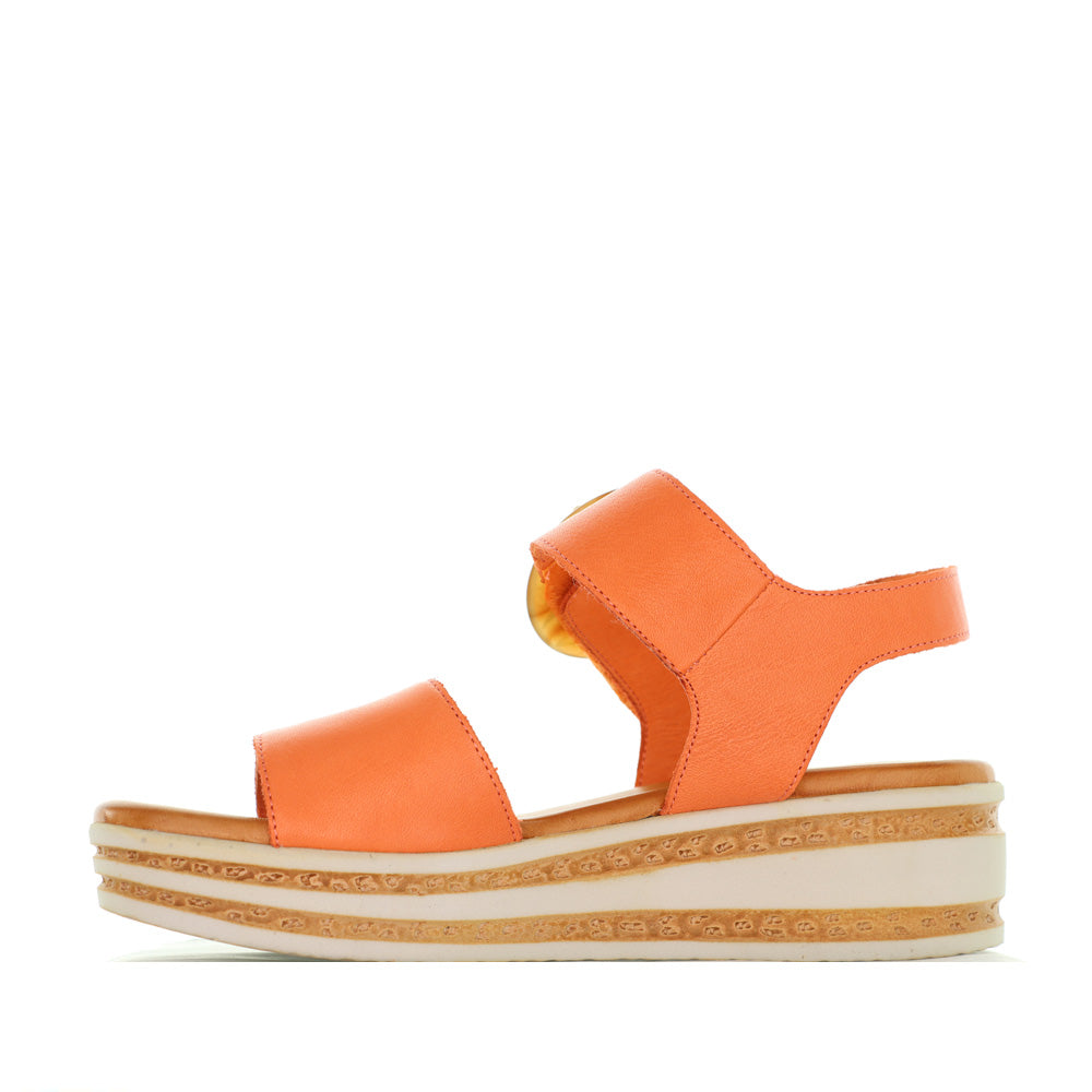 Le Sansa Guard Sunburn sandals with beige straps and cushioned soles, shown from a side angle.