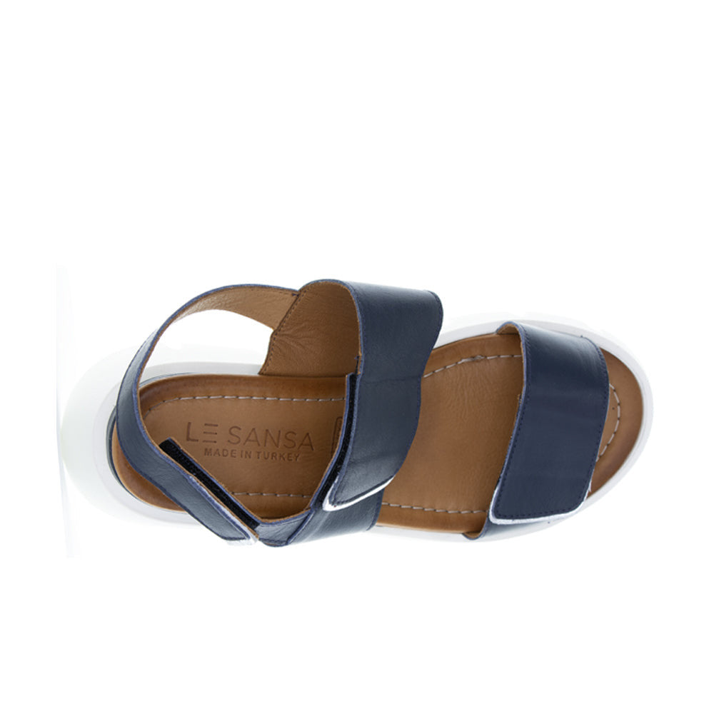Le Sansa navy and silver sandal with a sleek handle design, featuring stylish straps and a comfortable sole.