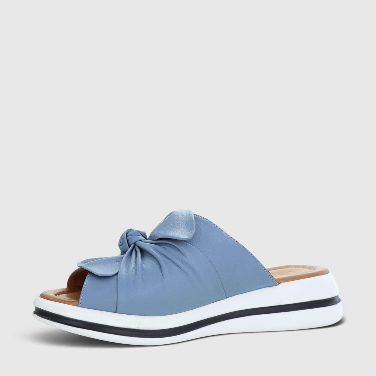 Le Sansa denim flats featuring a casual slip-on design with denim fabric and a comfortable flat sole.