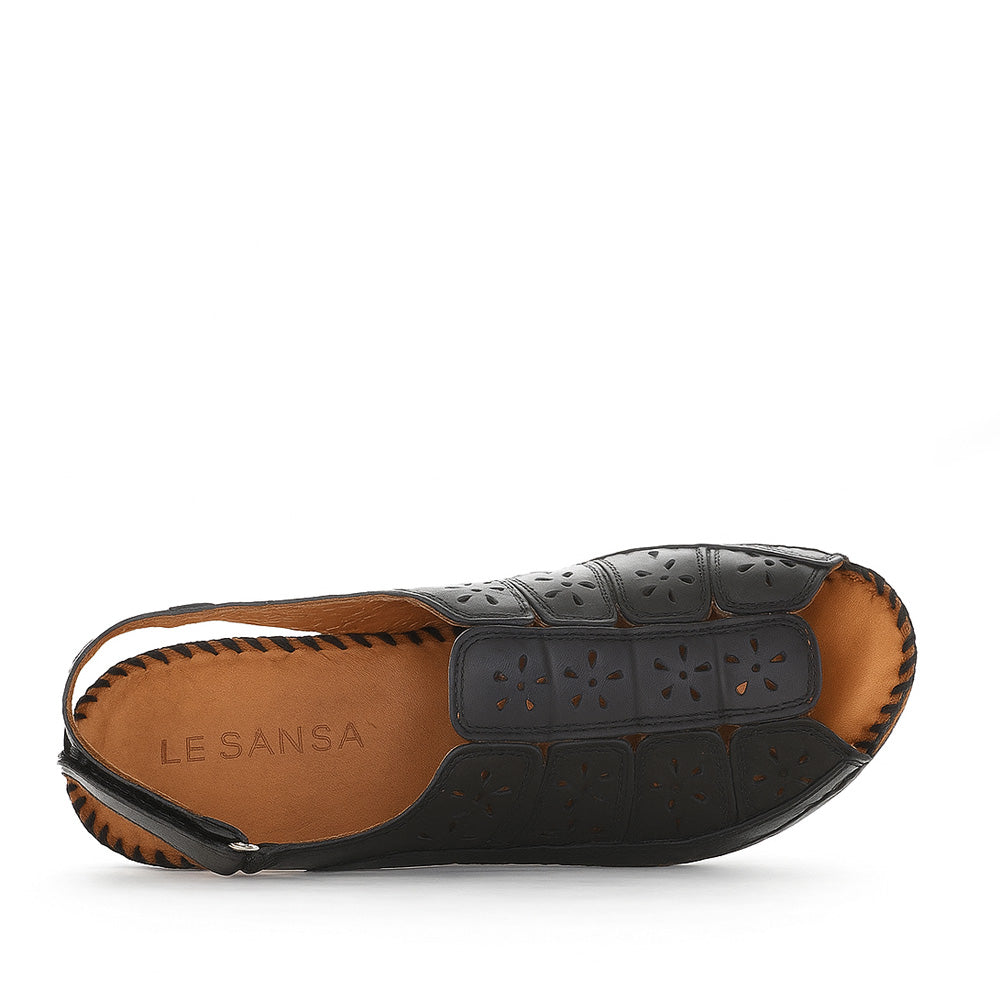 Le Sansa Kirra black sandals with open toes and ankle straps, featuring a stylish, minimalist design.