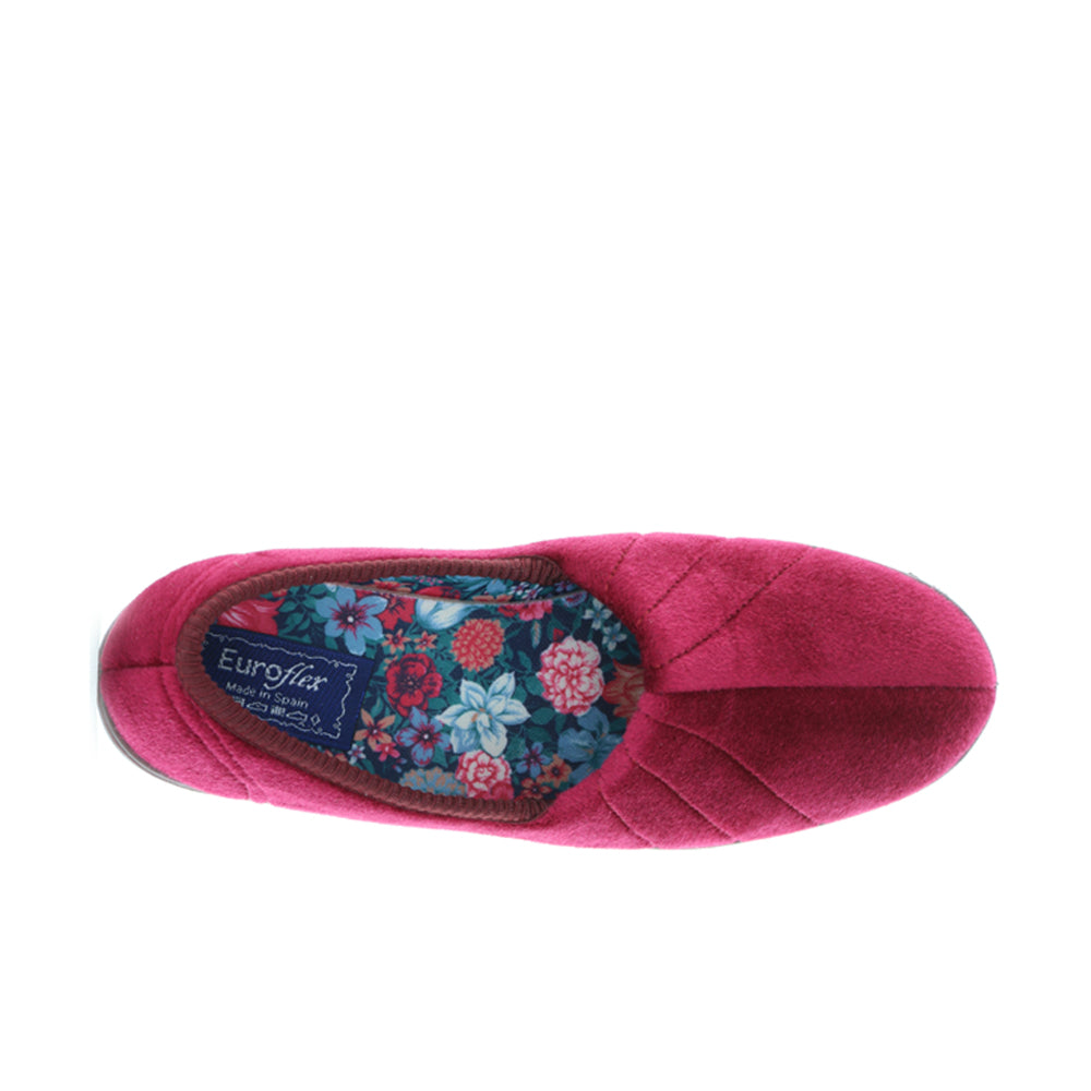 Euroflex Koala Burgundy slippers shown in a cozy indoor setting, featuring plush burgundy fabric and comfortable slip-on design.