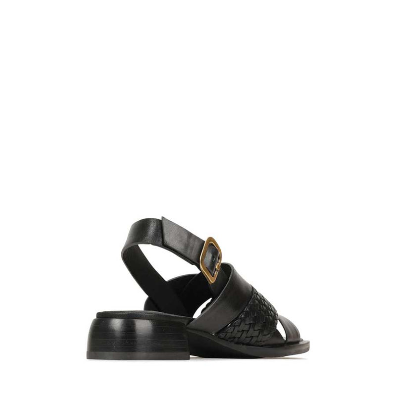 EOS Laticia Onyx sandals featuring black straps and a comfortable flat sole, perfect for casual summer wear.