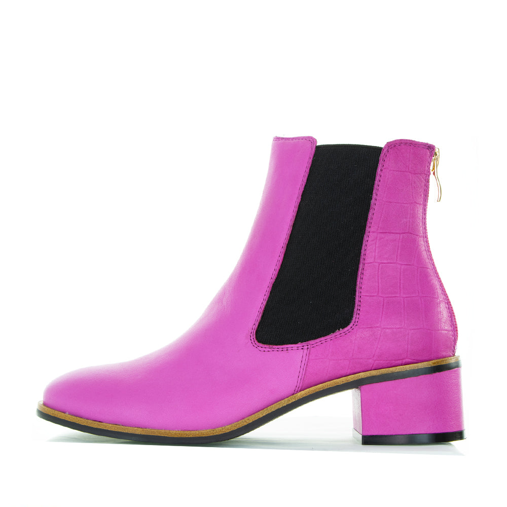 Le Sansa Remton hot pink boots with stylish design, featuring vibrant color and ankle-high style for a bold fashion statement.