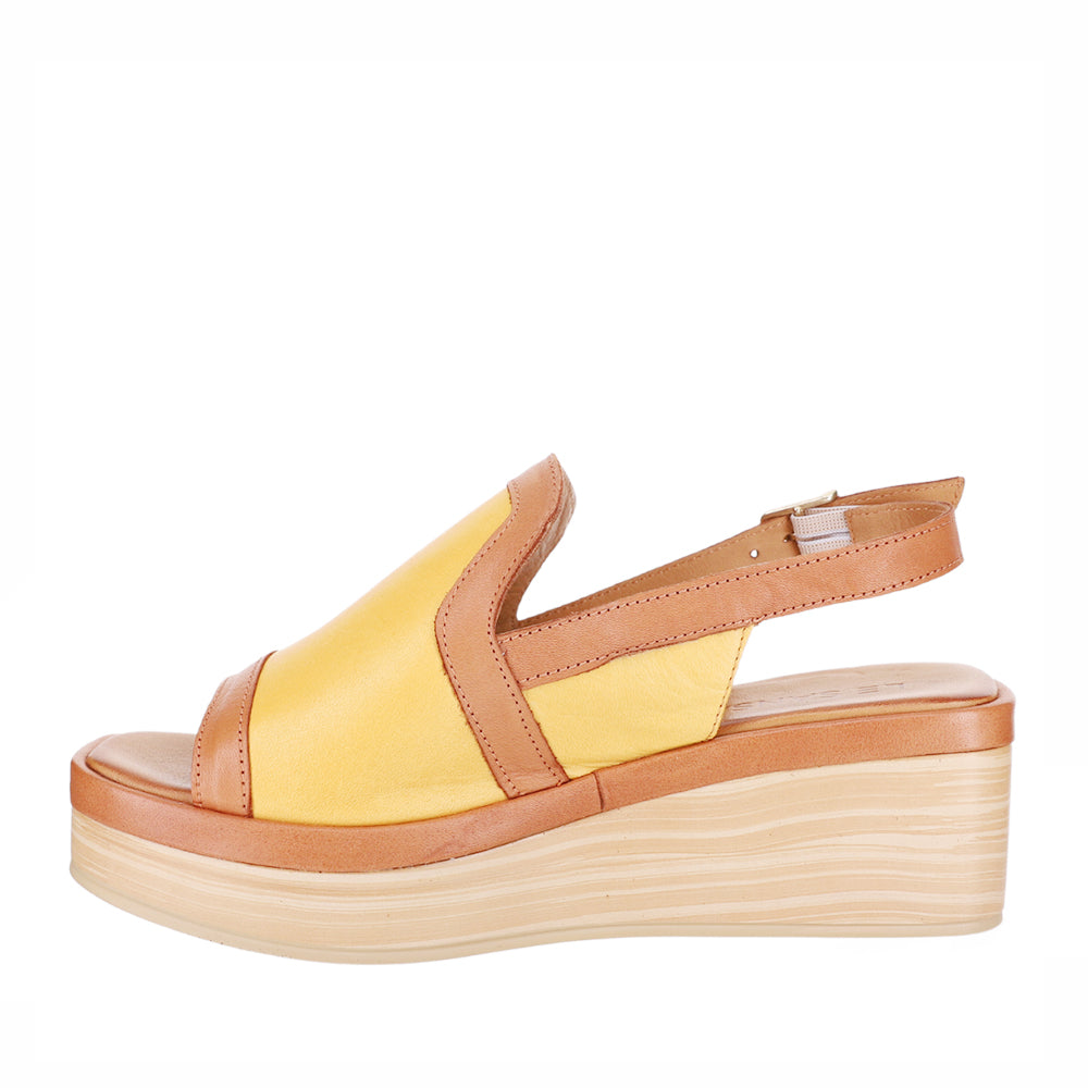 Le Sansa Trozan yellow tan sandals with open toes and ankle straps, stylish summer footwear on a neutral background.