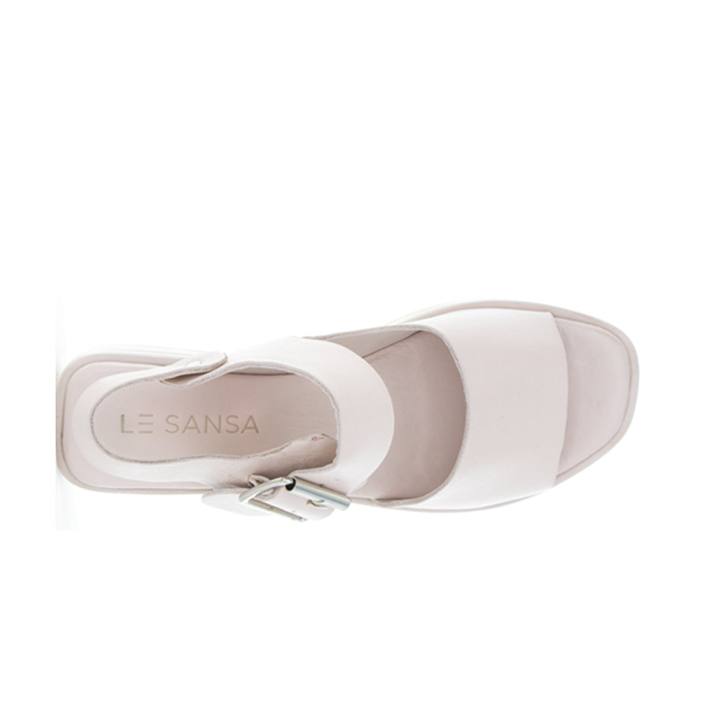 Le Sansa True Cameo sandals in beige with ankle straps, showcasing a stylish open-toe design and comfortable flat sole.