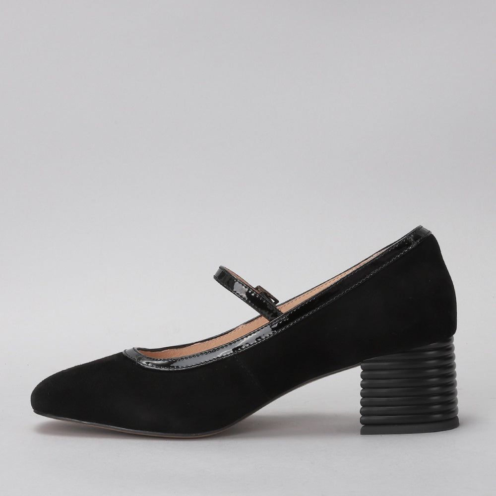 Black suede Le Sansa Zafira heels with pointed toes and stiletto heels, showcased on a neutral background.