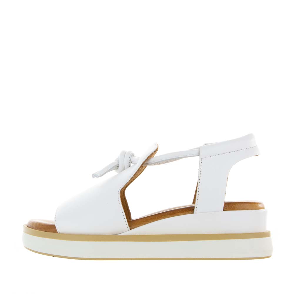 Le Sansa white leather sandals with open toes and ankle straps, stylish summer footwear for casual wear.