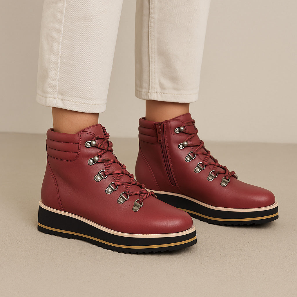 Le Sansa Lesansa Skip Bordo boots in black, featuring a sleek design with lace-up closure and ankle-high style.