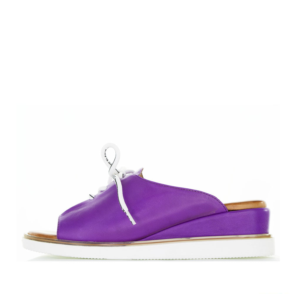 Le Sansa Lesansa Tinny purple slip-ons with a sleek design and comfortable fit, shown on a neutral background.