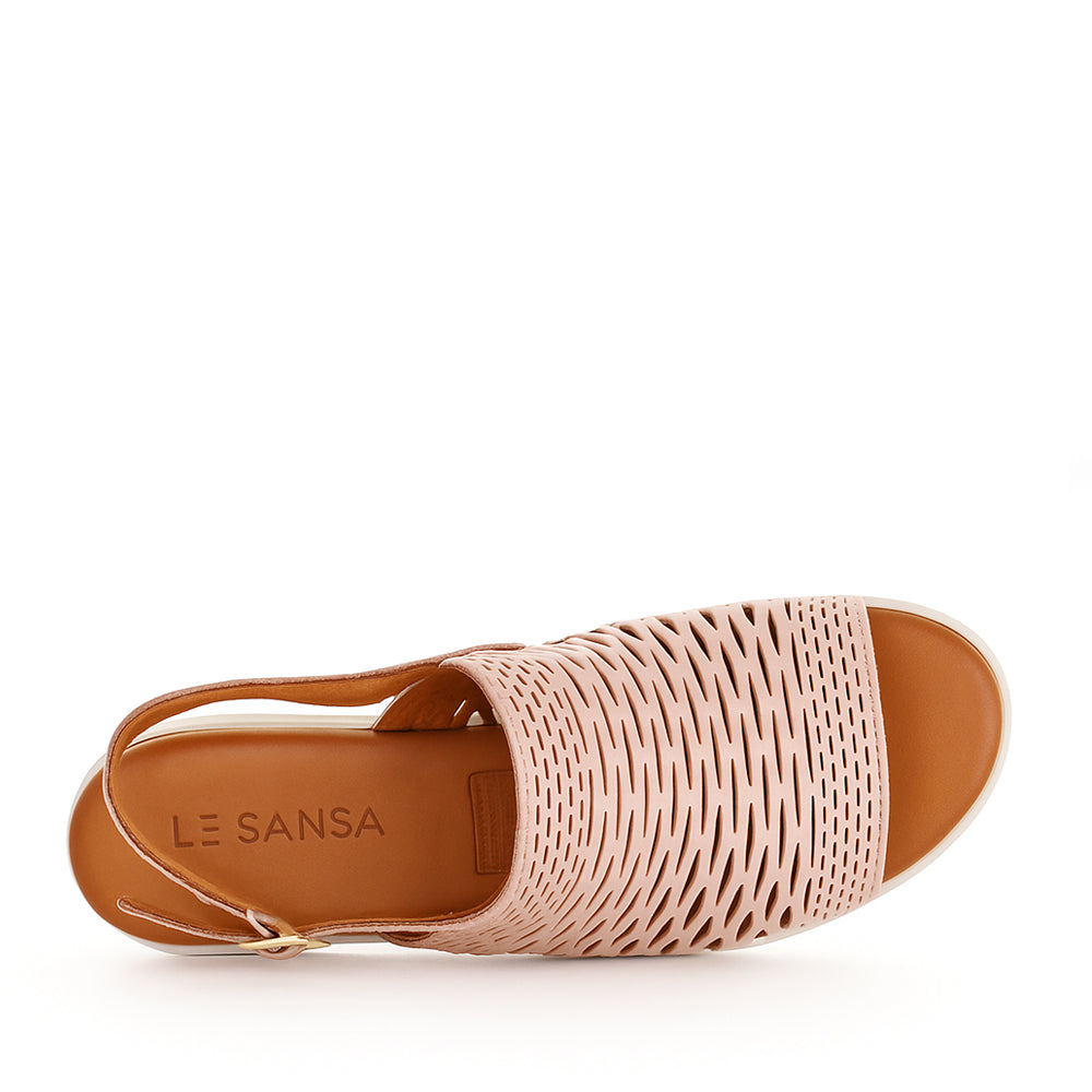Le Sansa Topaz Blush sandals featuring blush pink straps and comfortable flat soles, perfect for casual summer wear.