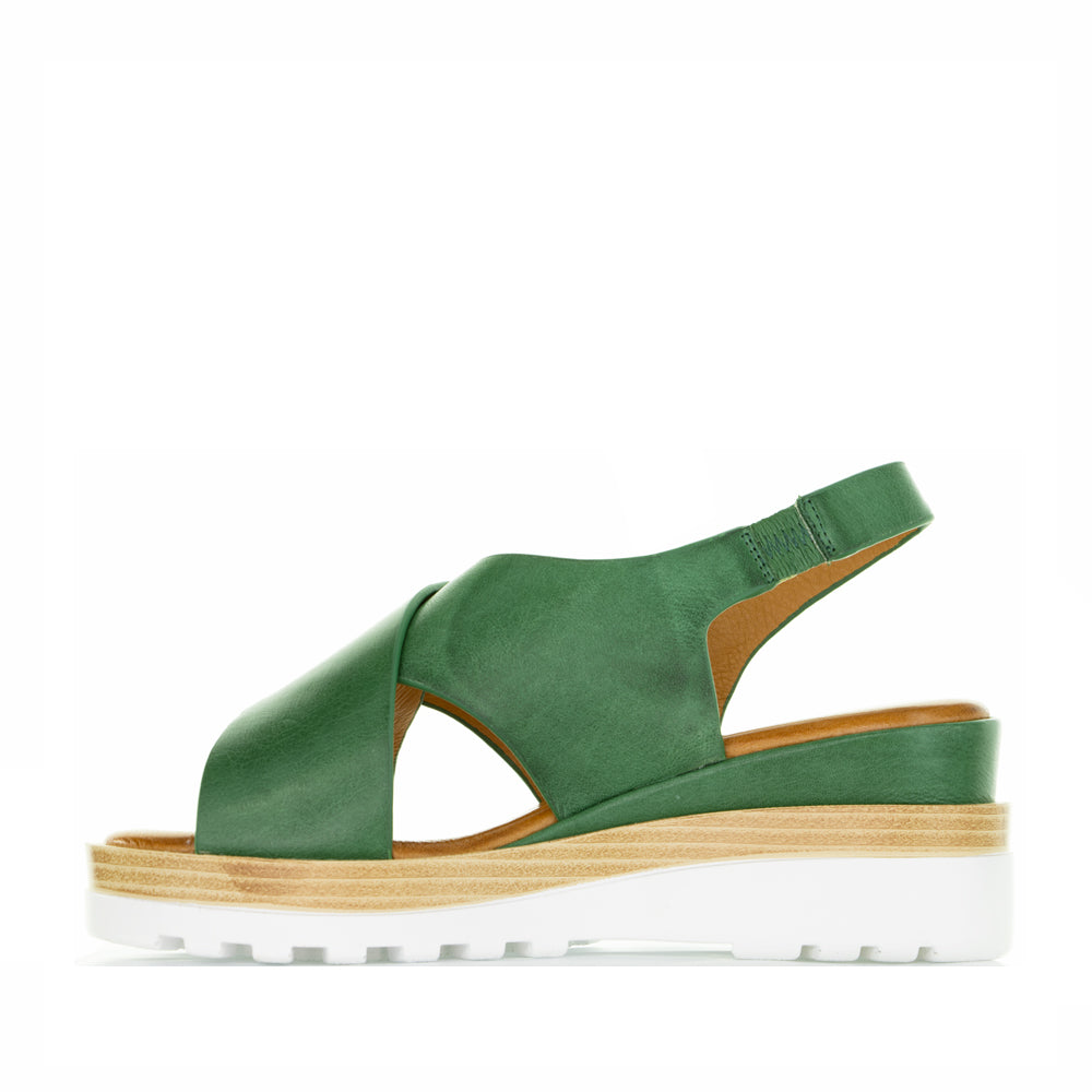 Le Sansa Trisha Pine sandals featuring a strappy design and neutral color, perfect for casual summer footwear.