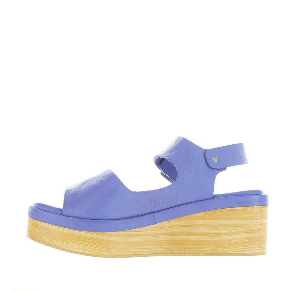 Le Sansa True Purple sandals with open toes and ankle straps, featuring a stylish purple leather design.