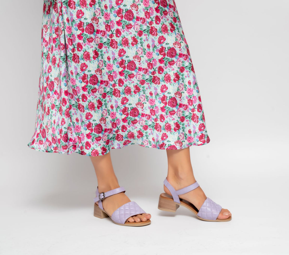 Le Sansa Lincoln Lilac sandals featuring open toes, ankle straps, and a comfortable flat sole.