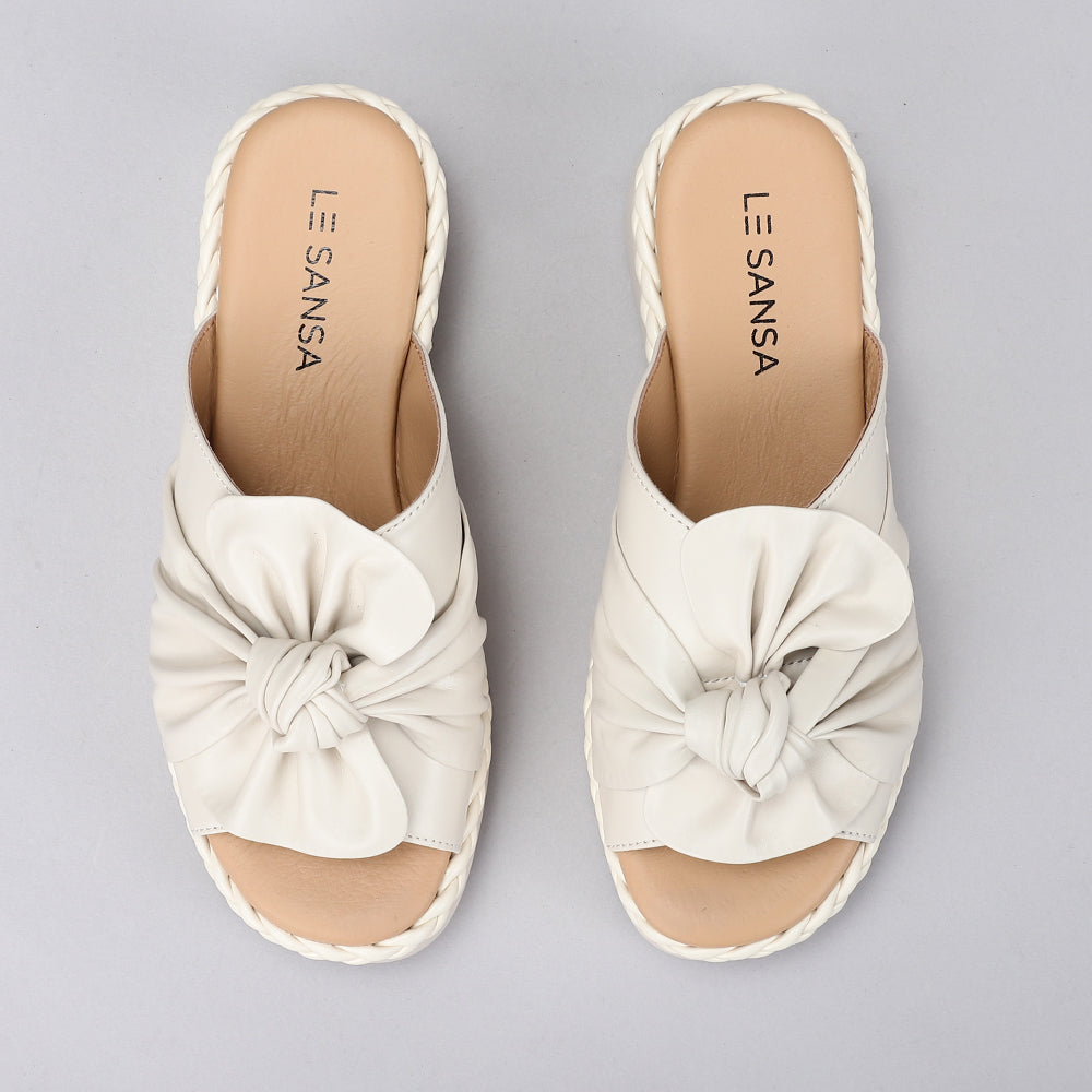 Le Sansa slip-on shoes in neutral tones, showcasing comfortable design and sleek style for casual wear.