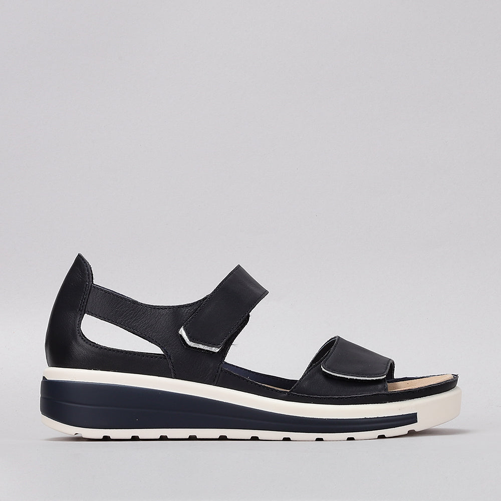 Naked Arches Happy Navy sandals with navy straps and cushioned footbed, designed for comfortable wear.