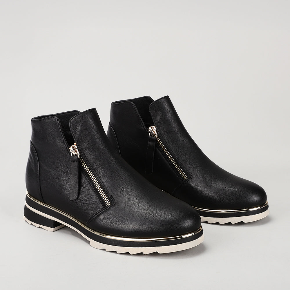 Black LE SANSA BASEL leather boots by Le Sansa, featuring ankle height, pointed toe, and sleek design.