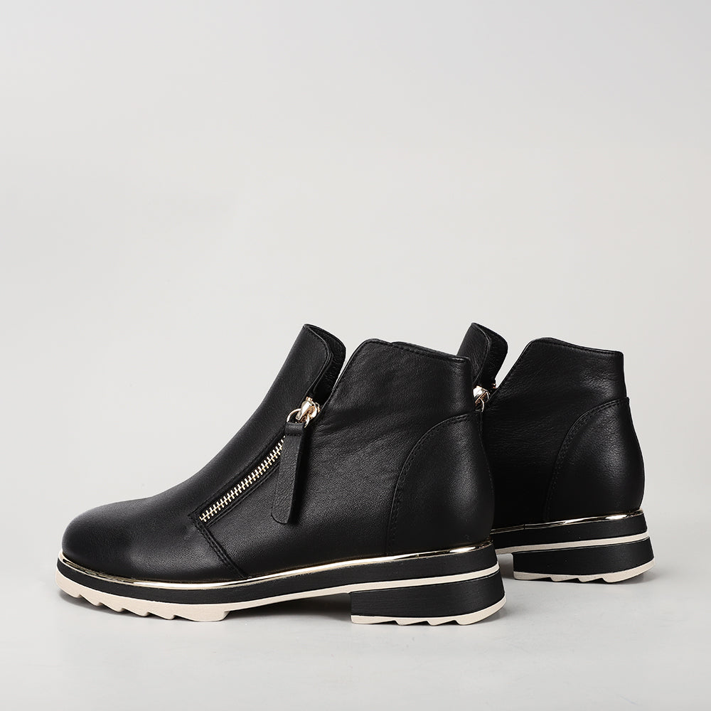 Black LE SANSA BASEL boots by Le Sansa with sleek leather design and low heel, perfect for stylish everyday wear.