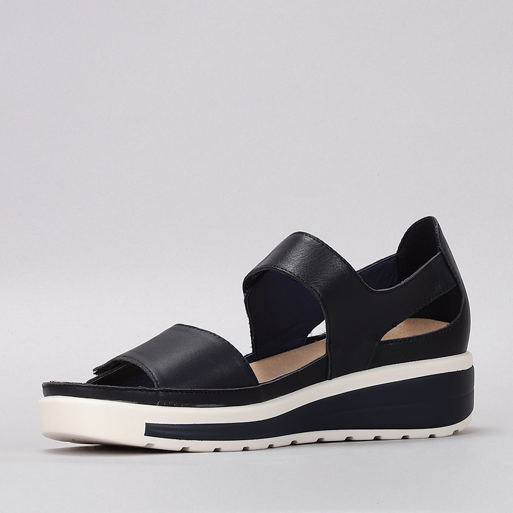 Naked Arches Happy Navy sandals with navy straps and cushioned footbed, showcasing a stylish and comfortable footwear design.