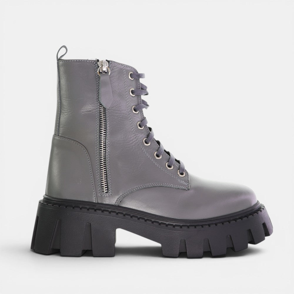 Le Sansa Roady Cement sneaker showing white and gray design with leather and mesh materials