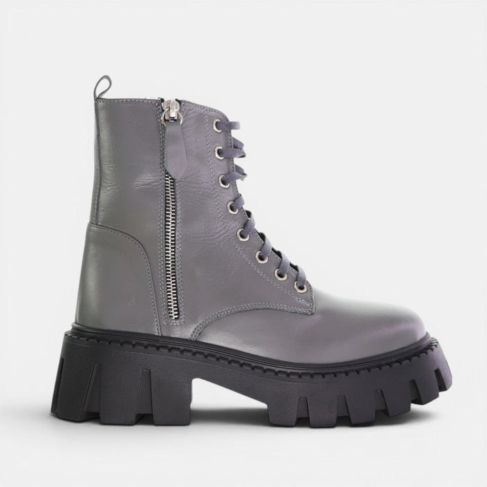 Le Sansa Roady Cement sneaker showing white and gray design with leather and mesh materials