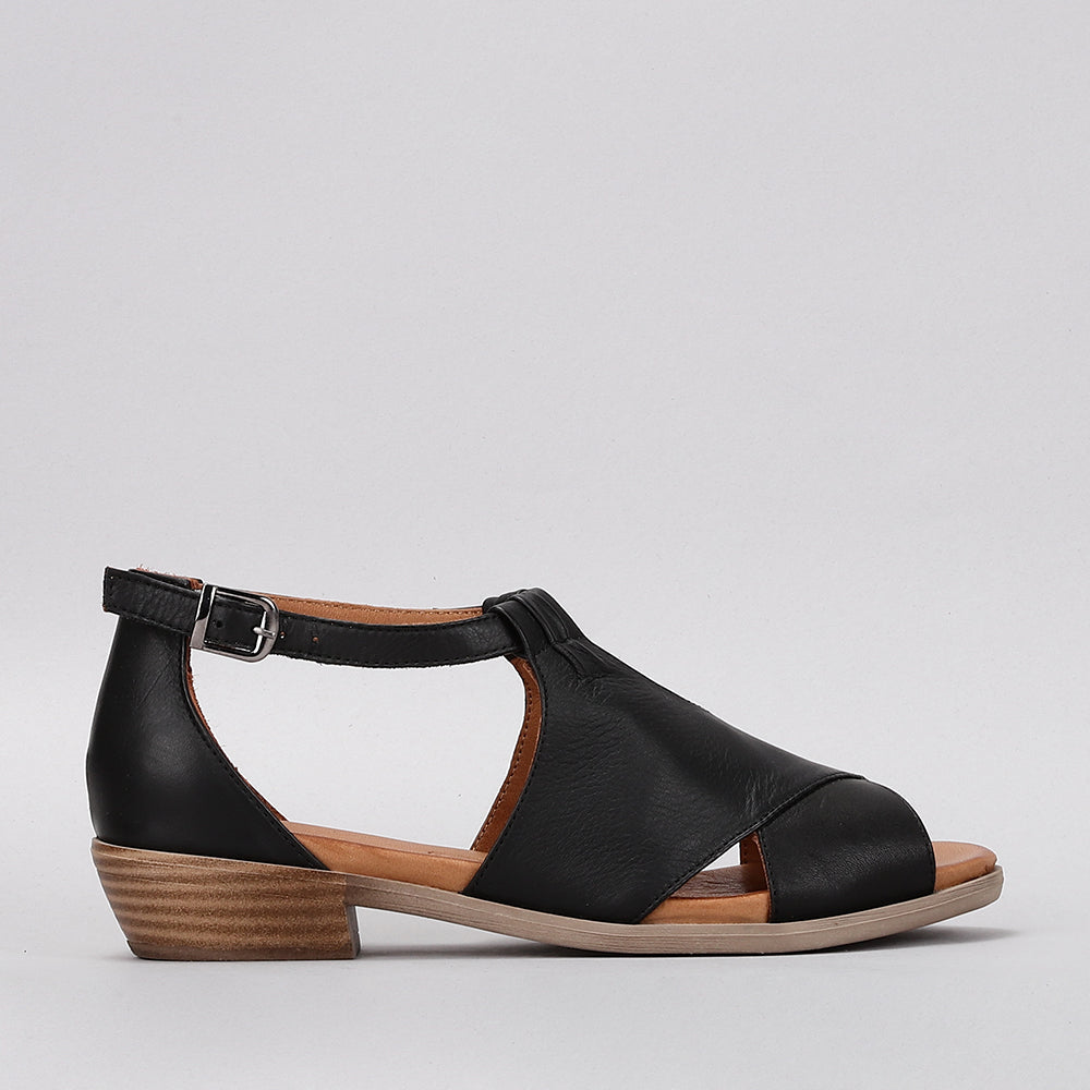 Black Le Sansa Digby sandals with ankle straps and open toe design, displayed on a neutral background.