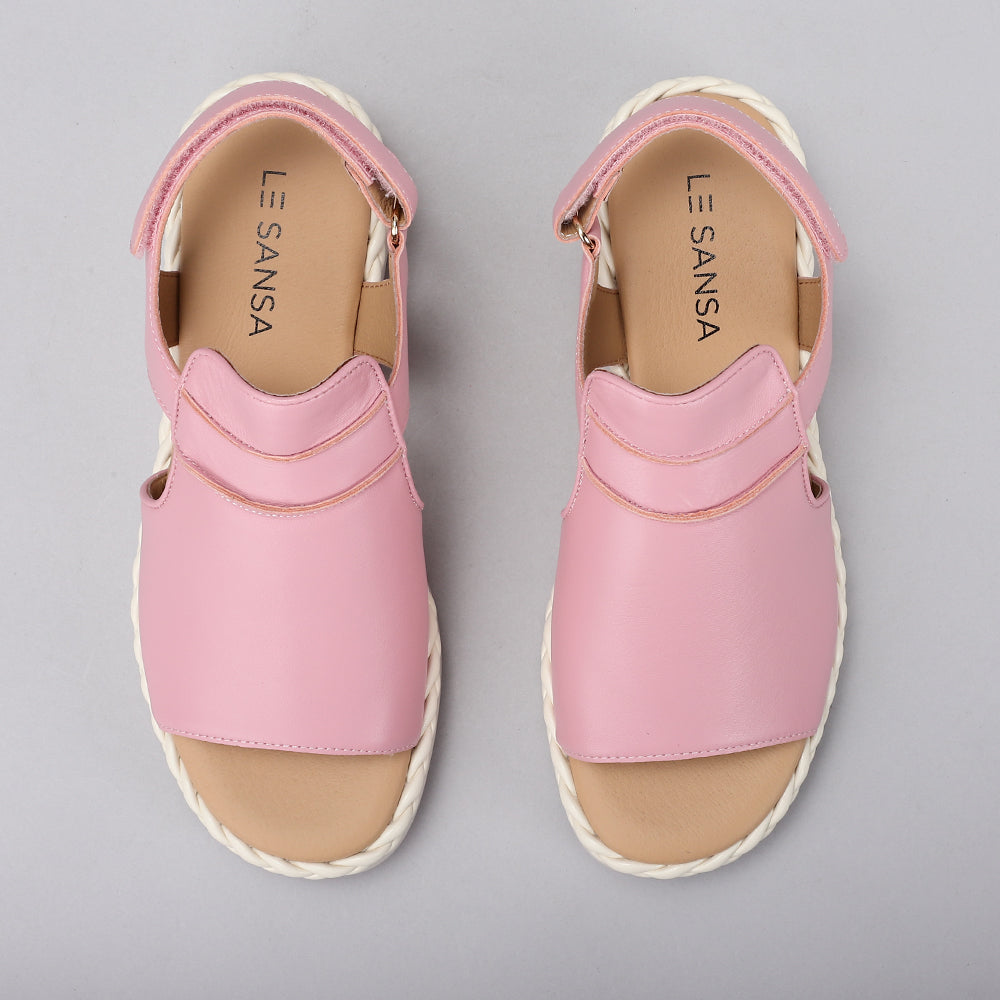 Le Sansa Emmeline baby pink sandals with adjustable straps and soft soles, perfect for young children.