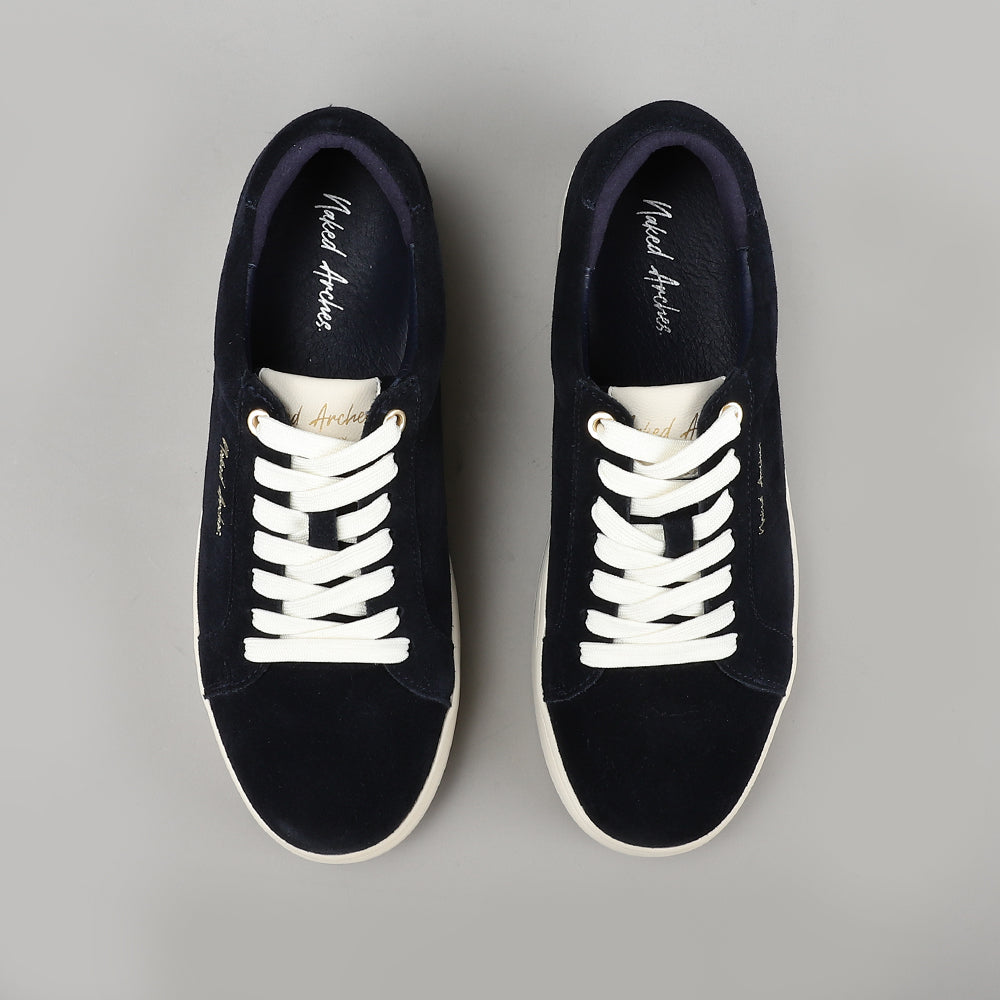 Naked Arches Azealia Navy sneakers with navy blue canvas upper, white rubber sole, and lace-up design on flat surface.