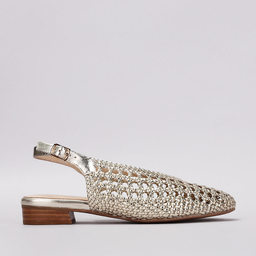 Le Sansa Camila light gold sandals with strappy design and flat sole, stylish footwear perfect for casual or dressy outfits.