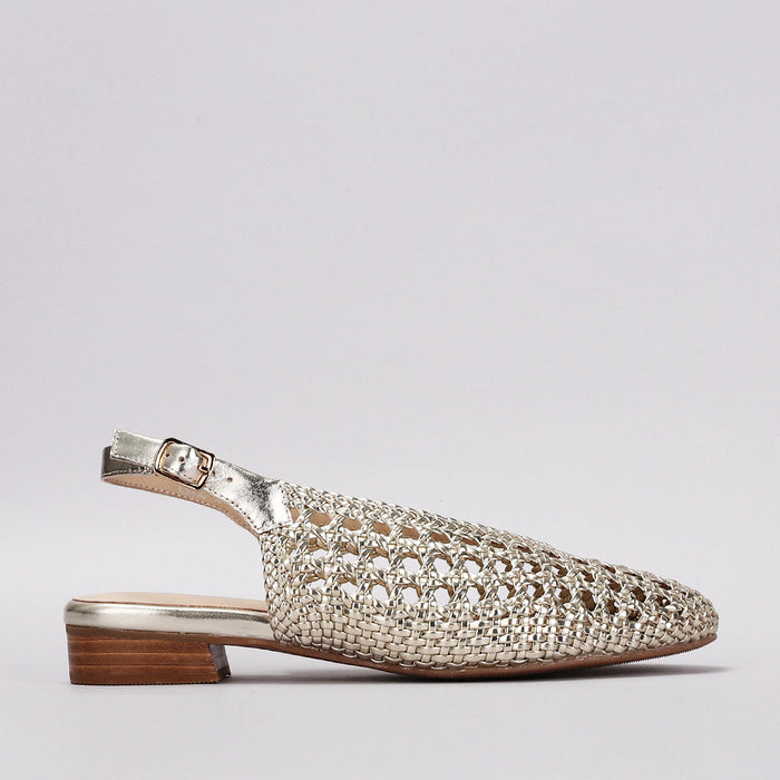 Le Sansa Camila light gold sandals with strappy design and flat sole, stylish footwear perfect for casual or dressy outfits.