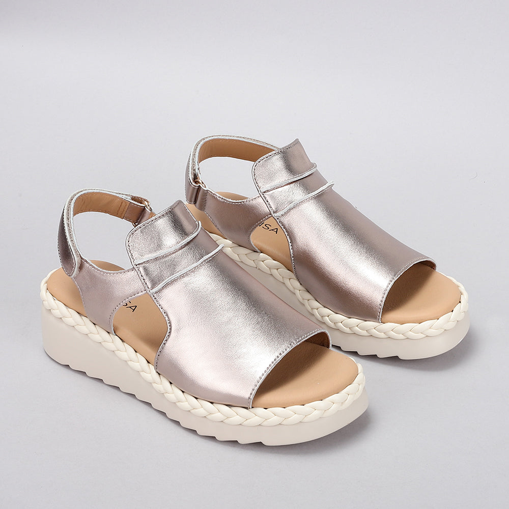 Le Sansa Sansa Emmeline Gold sandals with strappy design and gold finish, displayed on a neutral background.