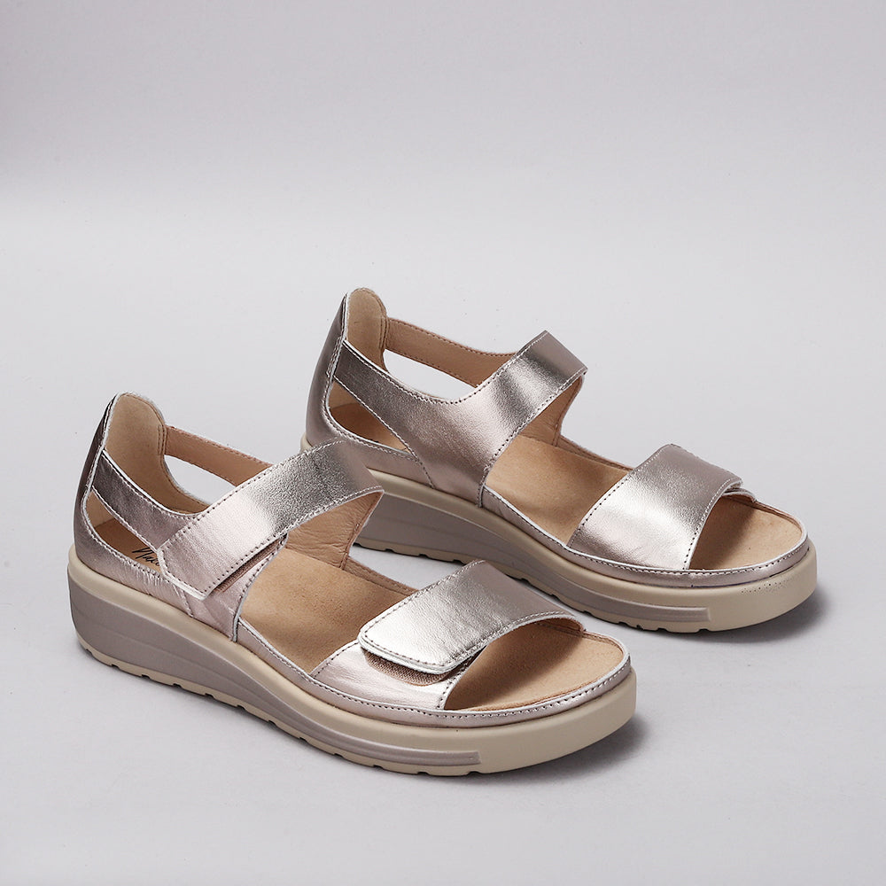 Naked Arches Happy Champagne sandals featuring a stylish open-toe design with cushioned straps and neutral champagne color.