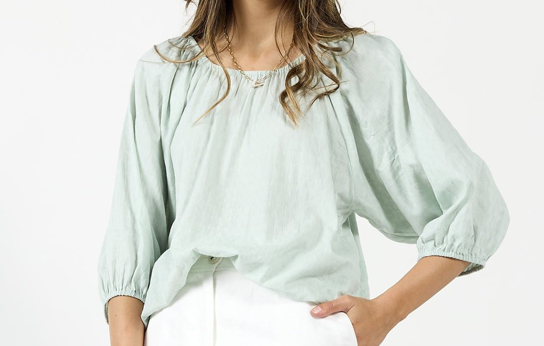 Drama The Label Milos mint top, a stylish sleeveless blouse with a relaxed fit, perfect for casual and chic outfits.