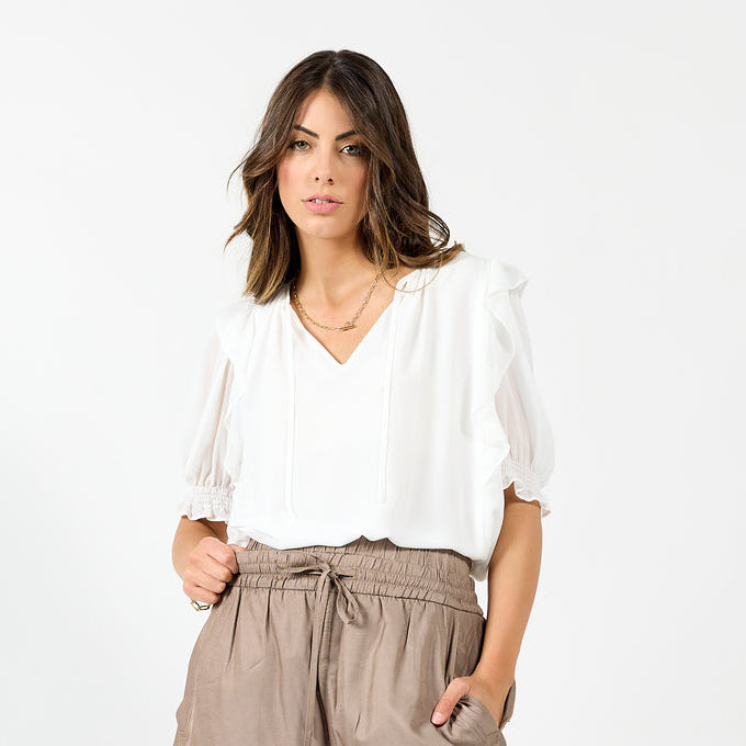 White Angel blouse by Drama The Label, featuring a stylish sleeveless cami top with a soft, flowy fabric and delicate design.