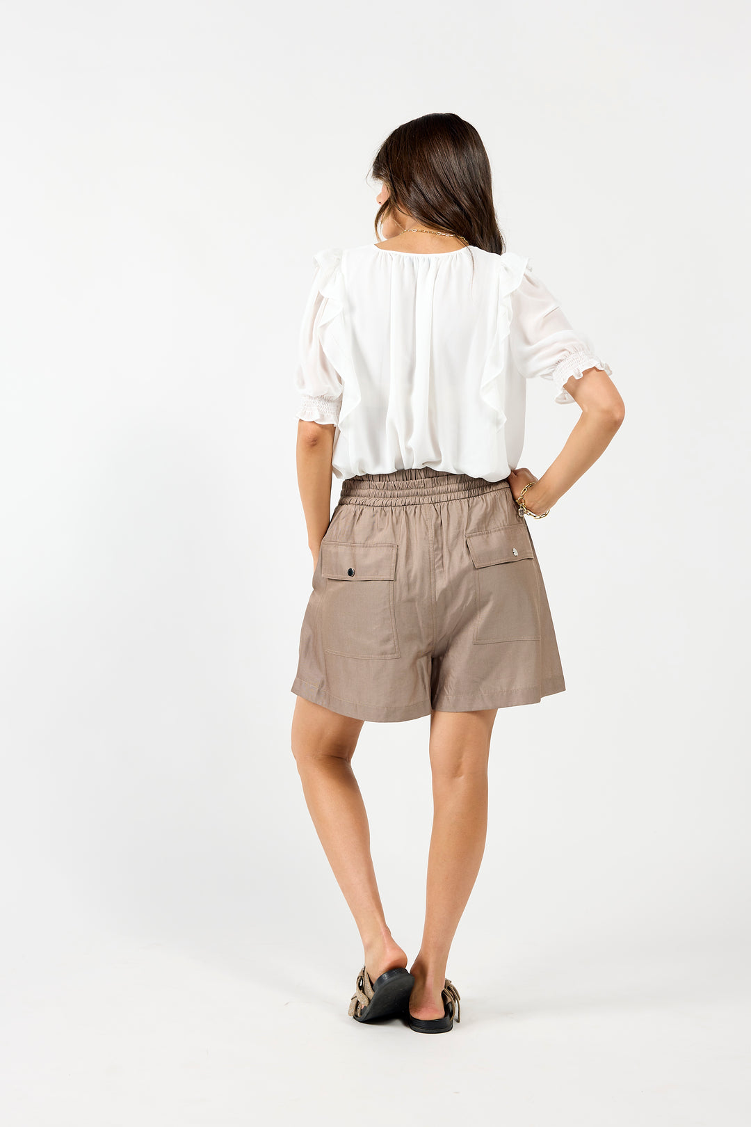White Drama The Label Angel blouse featuring delicate fabric and a stylish, feminine design, perfect for casual or dressy occasions.
