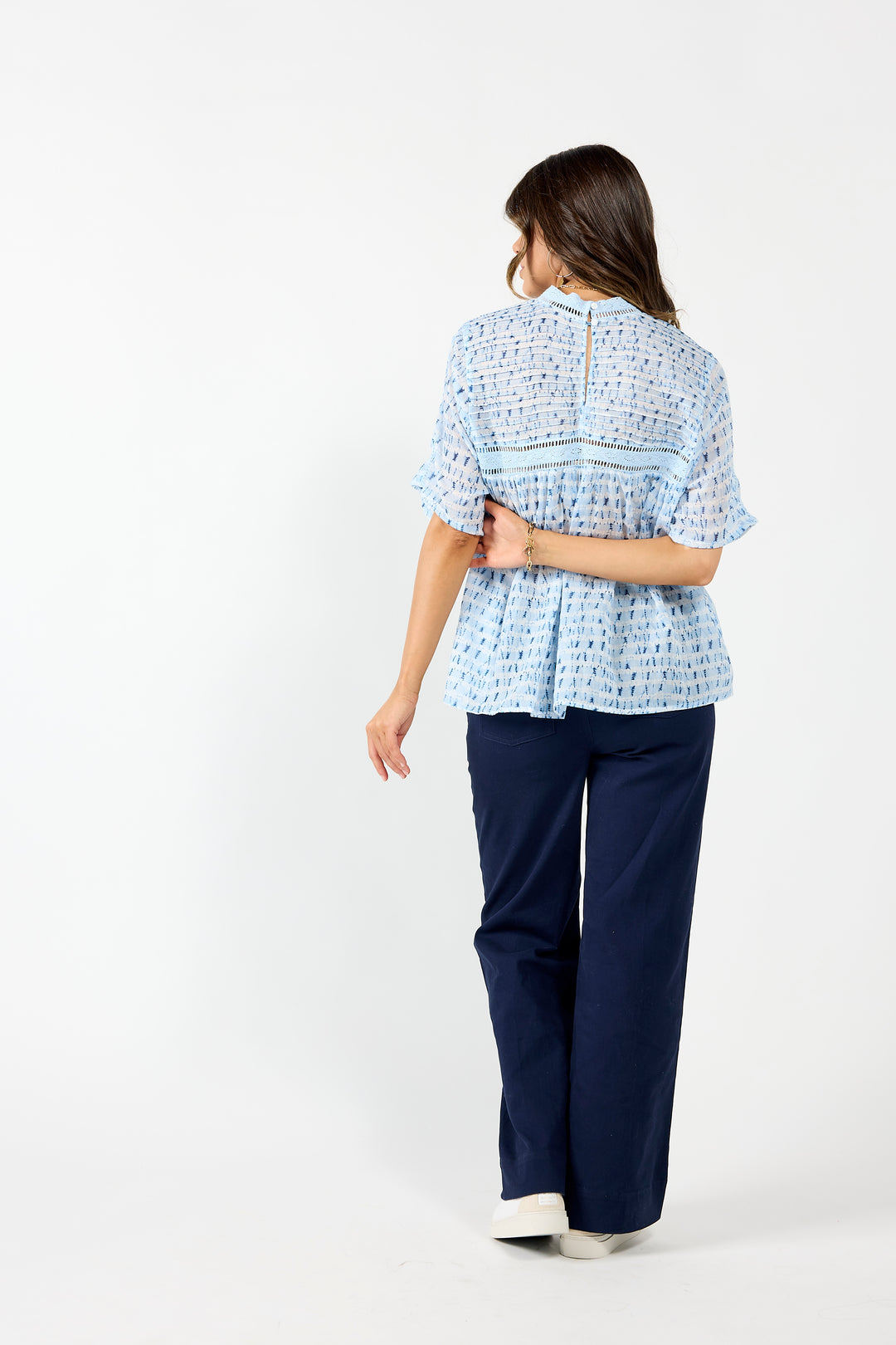 Blue Cypress blouse by Drama the Label, featuring lightweight fabric and a relaxed fit, styled on a model with casual denim.