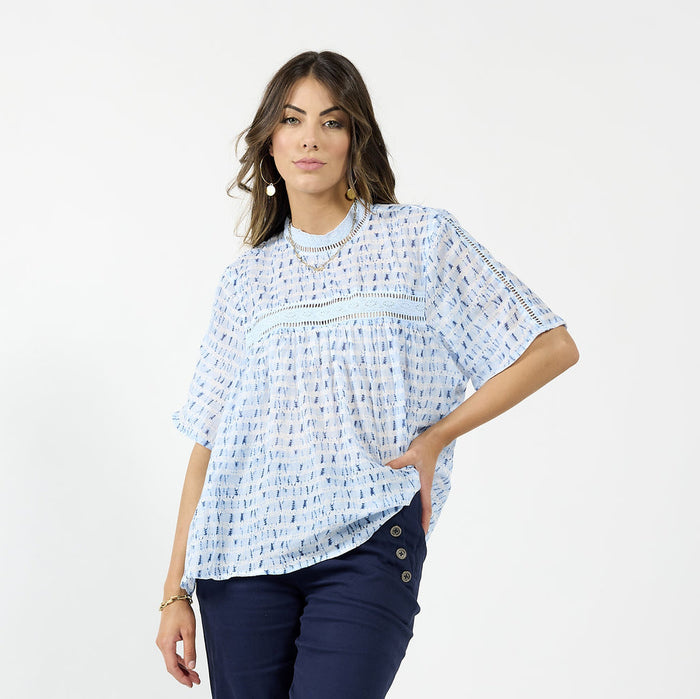 Blue Cypress blouse by Drama The Label, stylish sleeveless top with a relaxed fit, featuring a water-inspired pattern and flowing fabric.