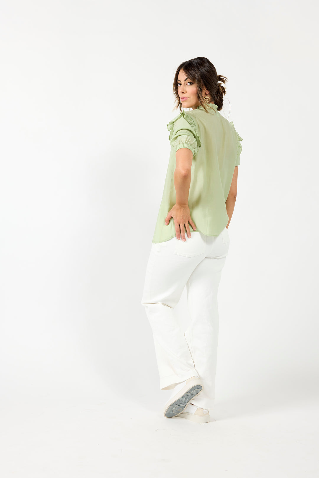 Drama The Label Bianca blouse in off-white with a sleeveless design, featuring a lightweight, flowy fabric and subtle seam details.