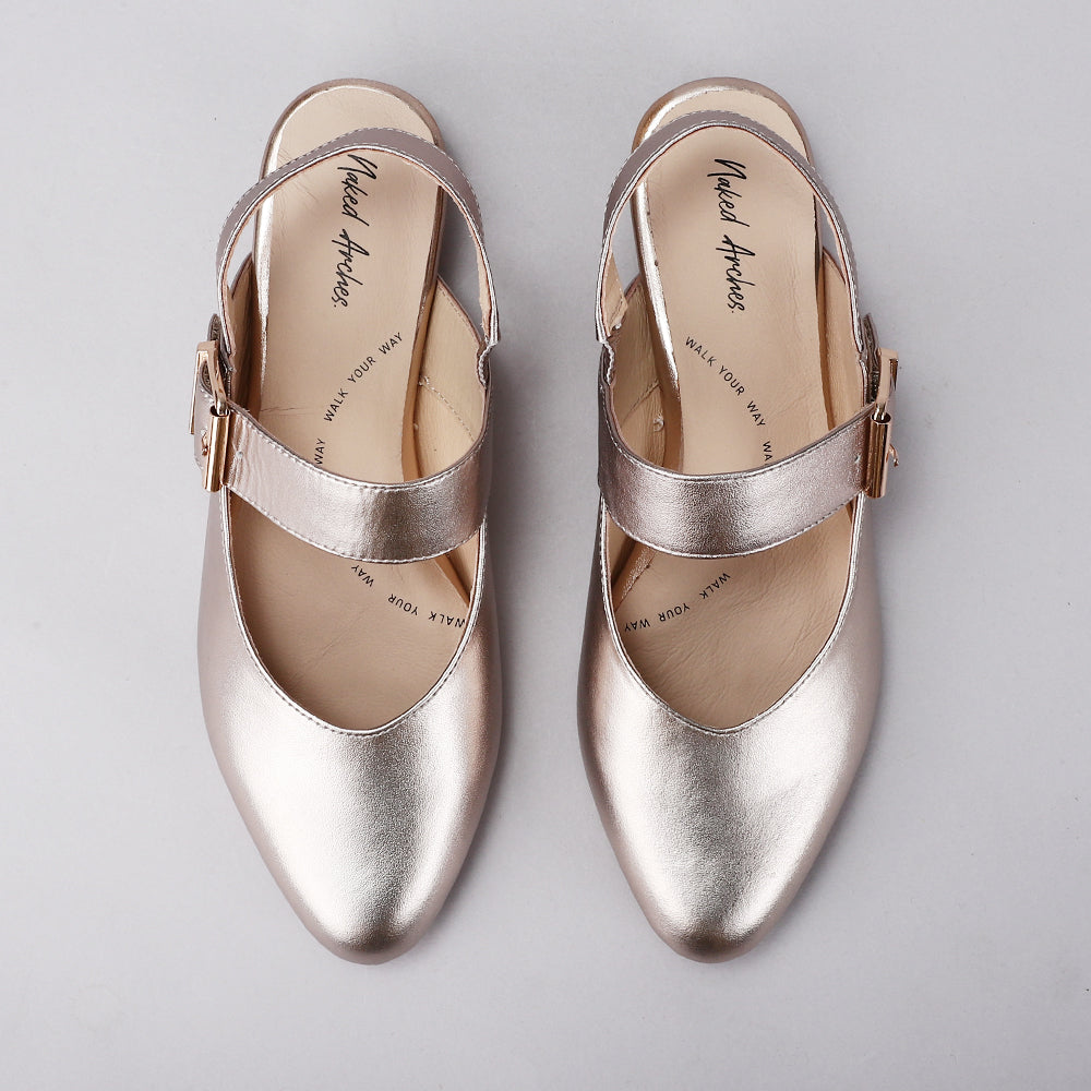 Naked Arches Yoko Champagne sandals with elegant straps and minimalist design, featuring a nude champagne color.