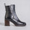 Black EOS Katt boots featuring sleek design and stylish ankle height, perfect for casual or evening wear.