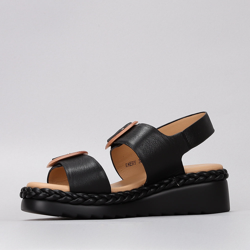 Le Sansa Sansa Emery Black sandals featuring sleek black straps and a comfortable flat sole.